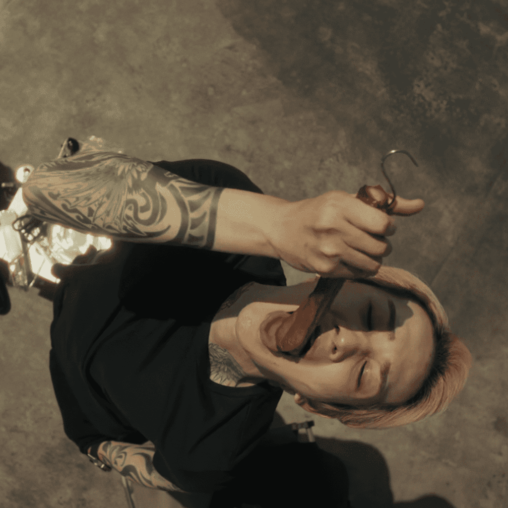 : A still from the Sins of Kujo review showing Mibu on the roof eating smoked meat