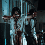 A high-stakes still for the If Wishes Could Kill Review showing an injured, blood-covered Ha-sal in the spirit realm as she yields her shamanic arrow.