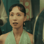 A historical flashback still for the Straight to Hell review showing a young Kazuko Hosoki landing her very first job in Tokyo's nightlife sector.
