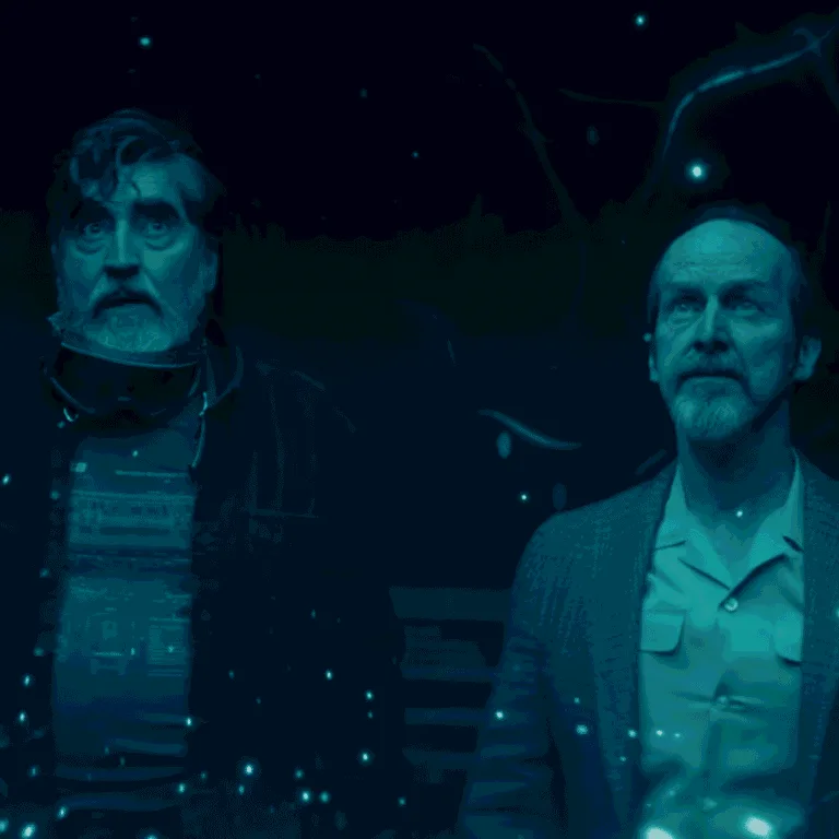 Sam and Wally standing in the middle of Sam's living room looking at the display left behind by the exploding alien DNA for The Boroughs Review.