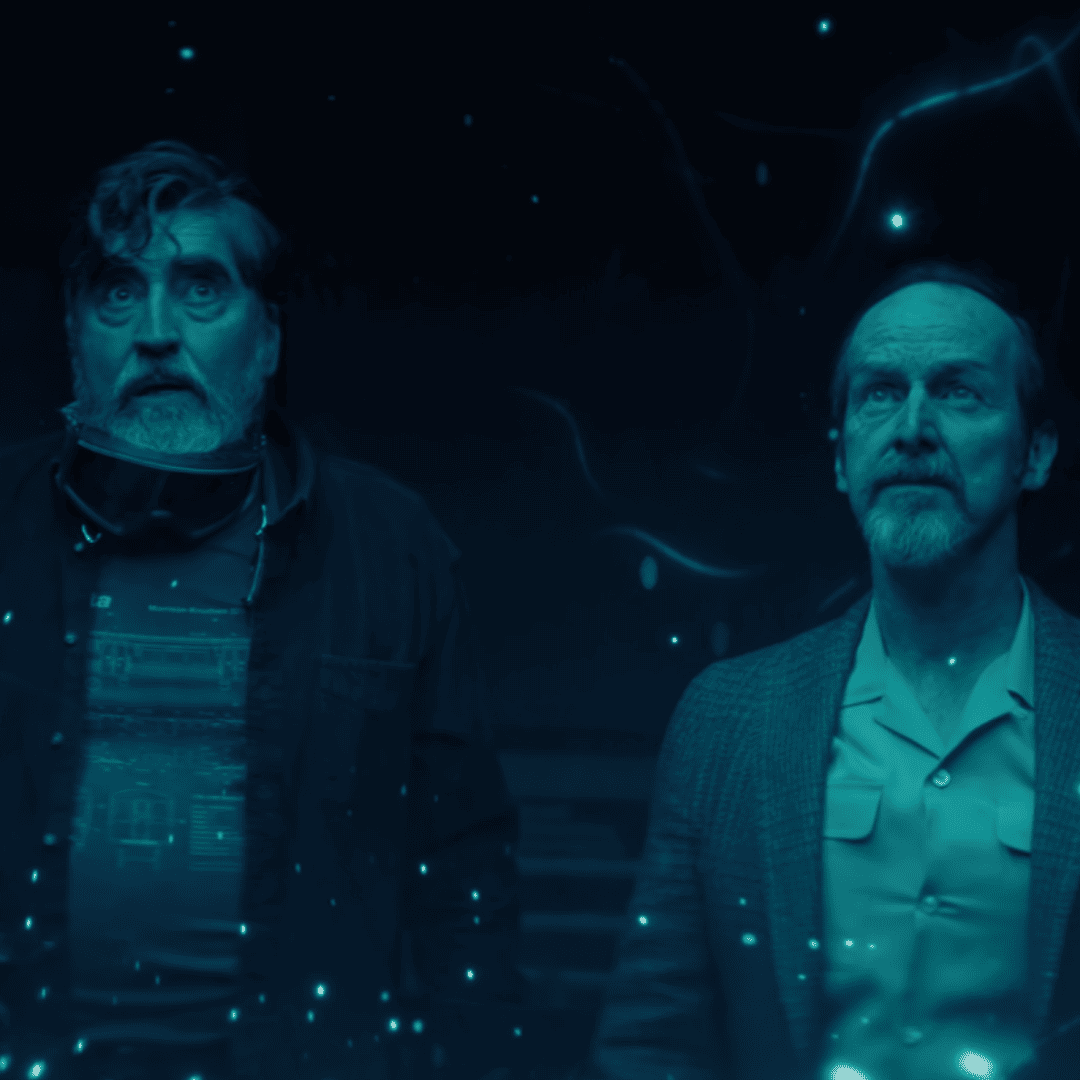 Sam and Wally standing in the middle of Sam's living room looking at the display left behind by the exploding alien DNA for The Boroughs Review.