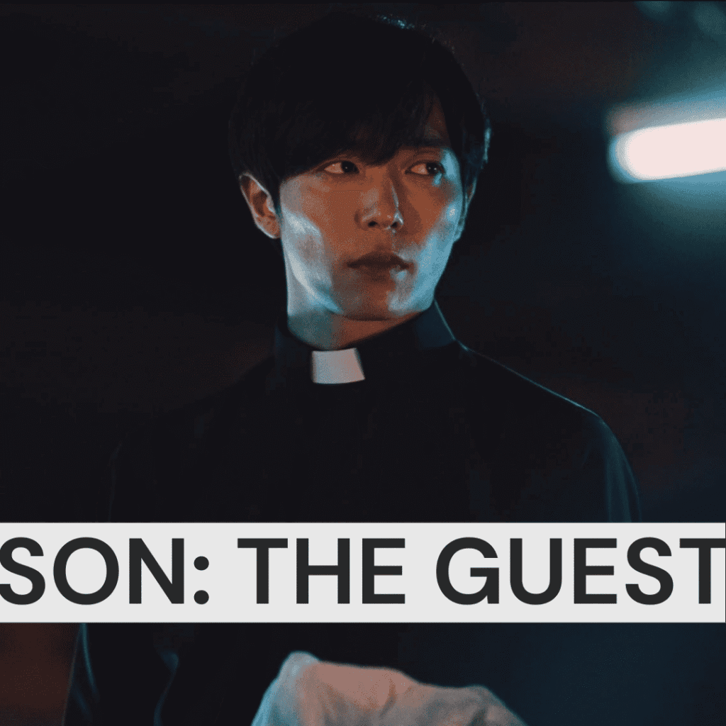 Atmospheric close-up still from The Guest showing the Catholic priest Choi Yoon dressed in dark attire against a black background, selected for our list of K-dramas to watch after The East Palace.